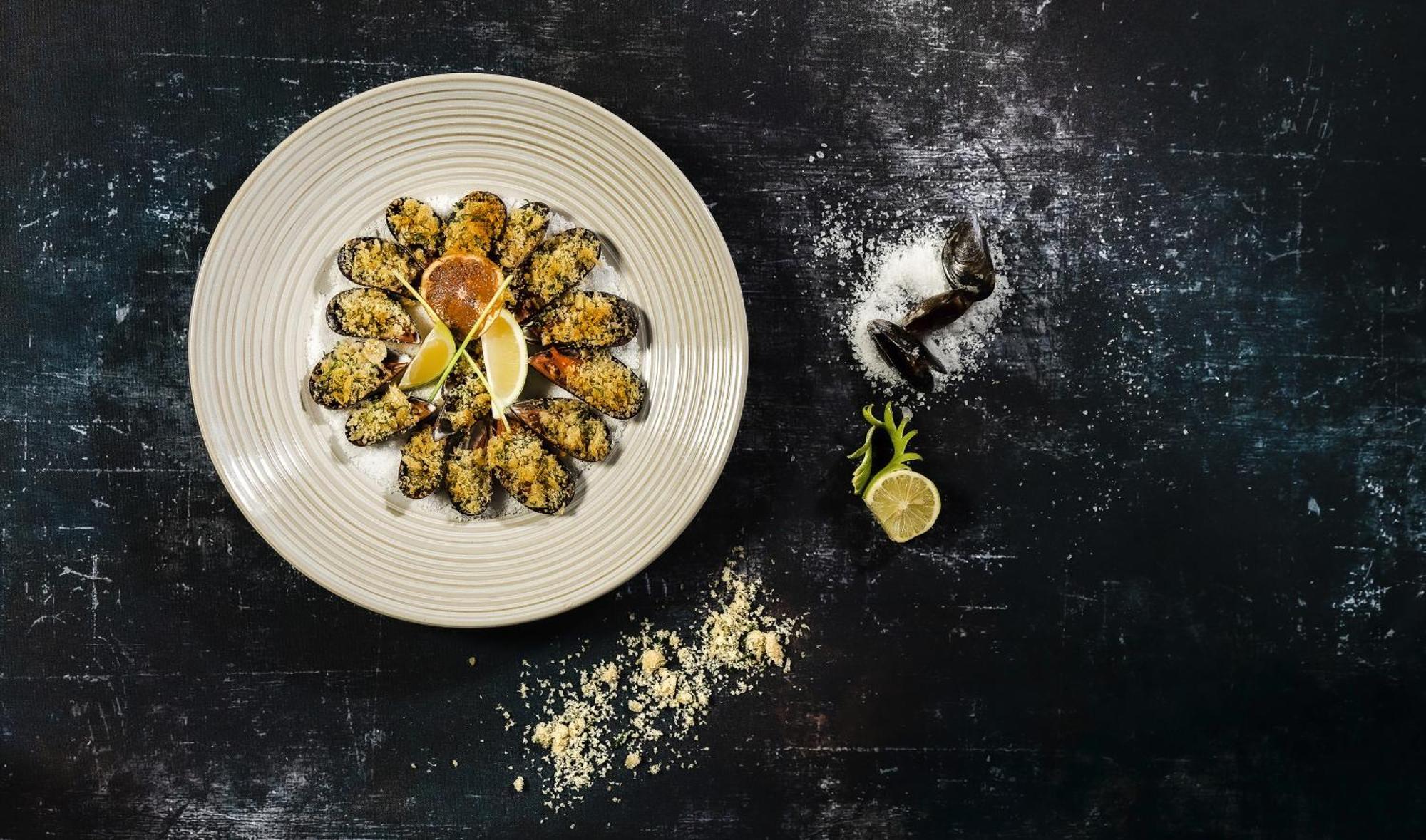Moevenpick Resort & Marine Spa Sousse Bagian luar foto A plate of grilled scallops
